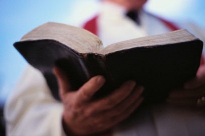 Pastor Holding Bible ca. 2000