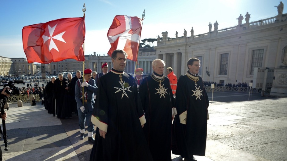 Knights of the Order of Malta walk in procession toward St. Peter's Basilica to mark the 900th anniversary of the Order of the Knights of Malta, on Saturday at the Vatican.